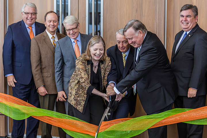 During a daylong celebration, UT Dallas President Richard C. Benson and Jindal School alumni Nancy and Chuck Davidson cut the ribbon to officially open the new alumni center.  Among the guests were representatives of the UT System, the University Development Board and the city of Richardson.