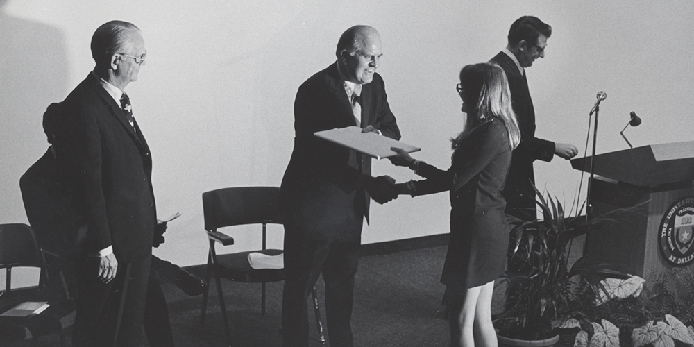 First UT Dallas President Dr. Bryce Jordan hands one of the first first UTD diplomas to Susan Seabury Mahlum MS’73