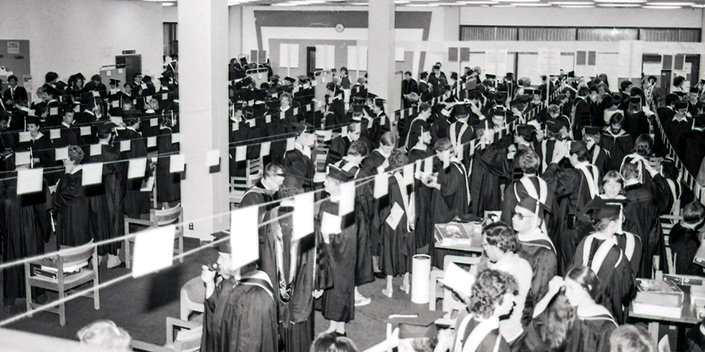 Graduates line up by name prior to an commencement ceremony