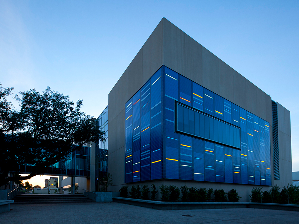 The Science Learning Center lit up at dusk