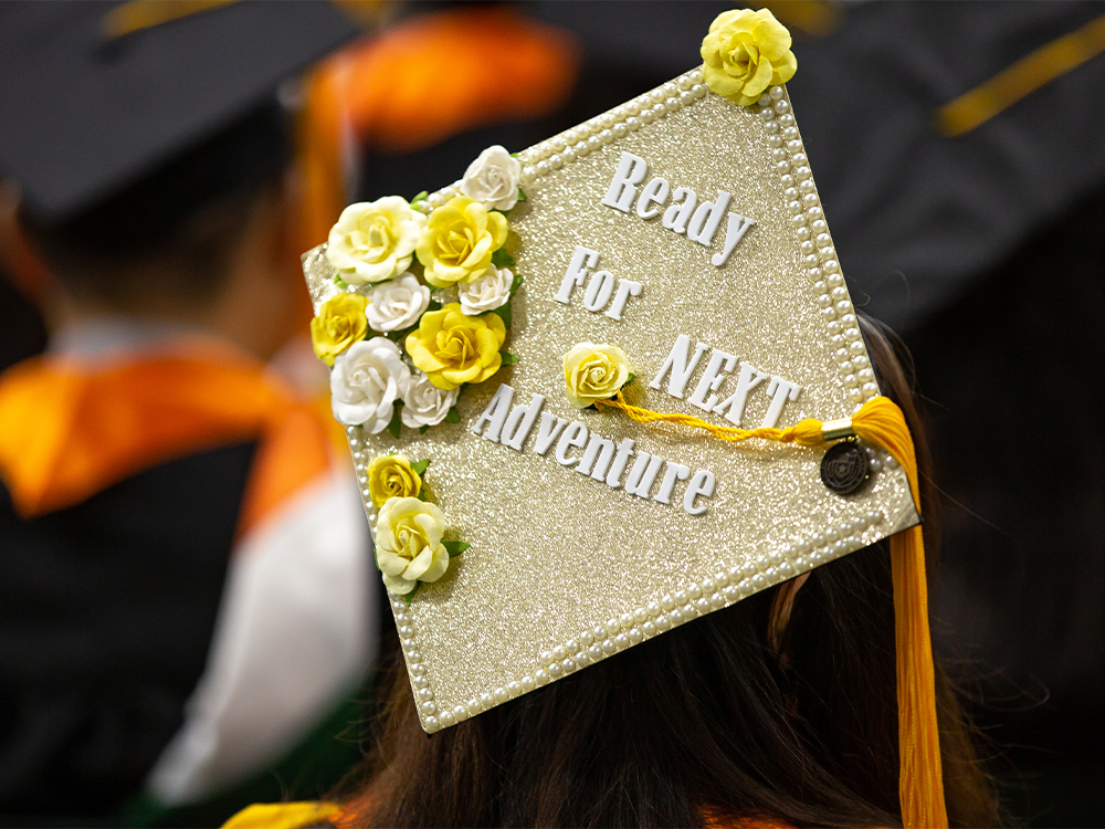 Graduation cap that reads ready for next adventure