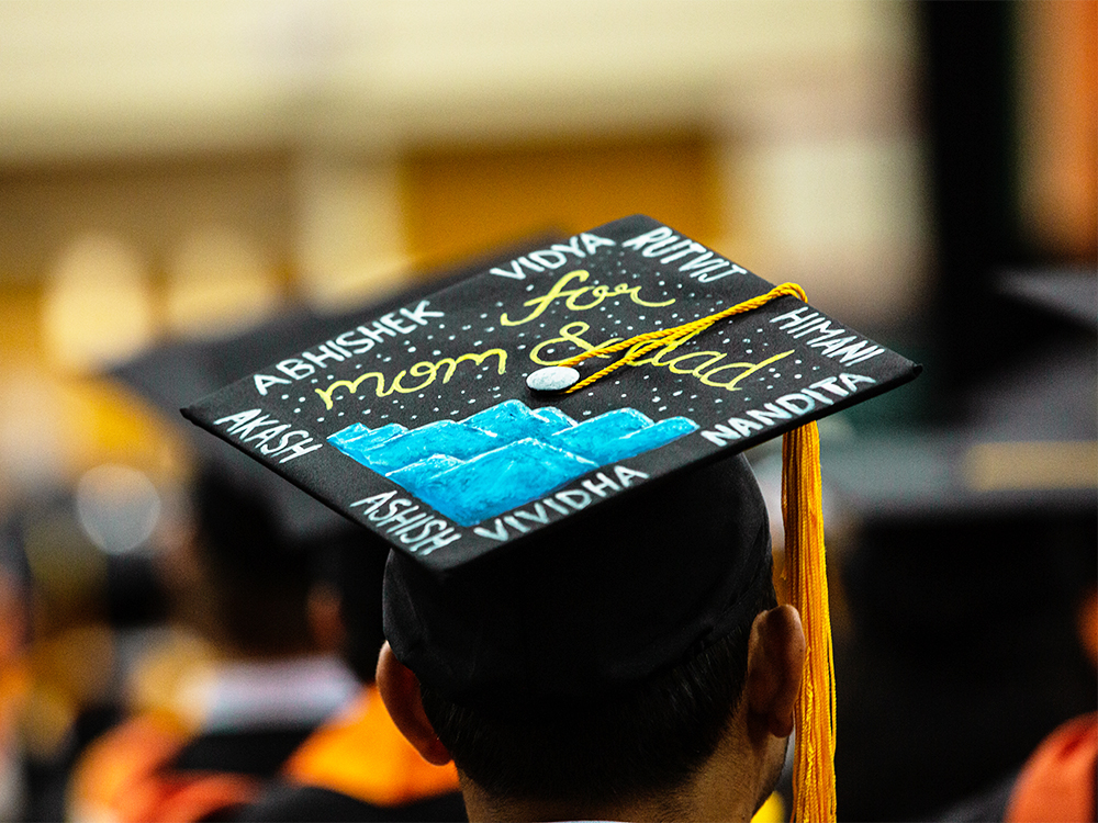 Graduation cap that reads for Mom and Dad