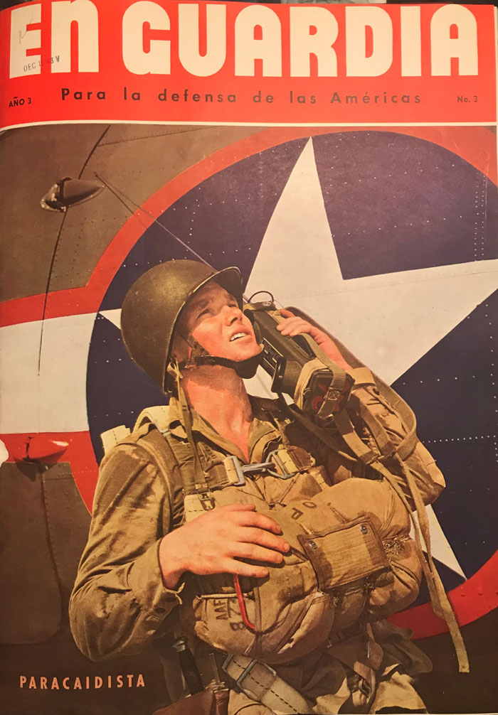 Cover of a magazine entitled En Guardia. Cover images shows a soldier wearing helmet and talking into a radio.