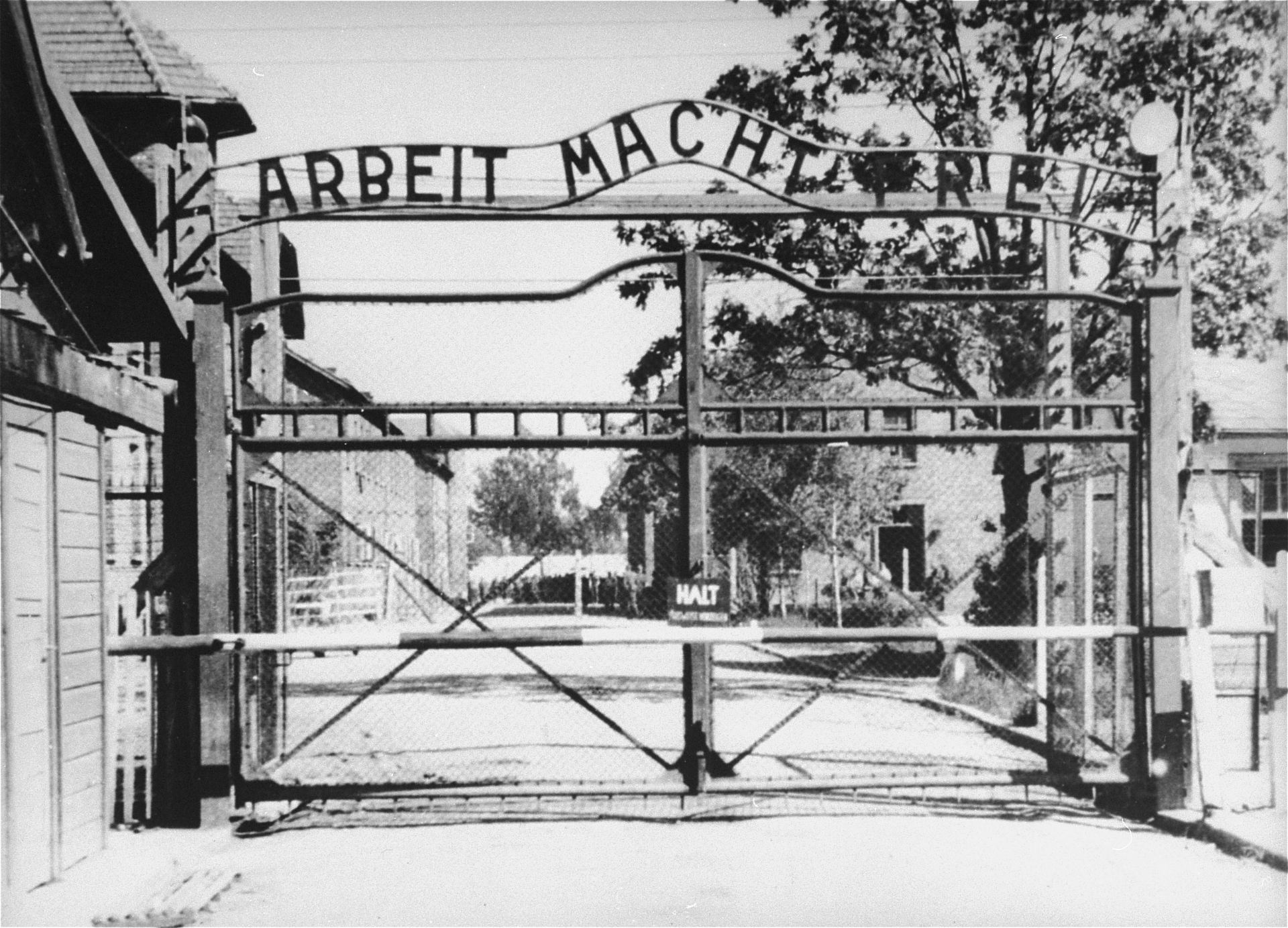 This view is of the entrance to the main Auschwitz concentration camp. The gate bears the motto Arbeit Macht Frei - “work makes one free.” (United States Holocaust Memorial Museum, courtesy of Instytut Pamieci Narodowej)