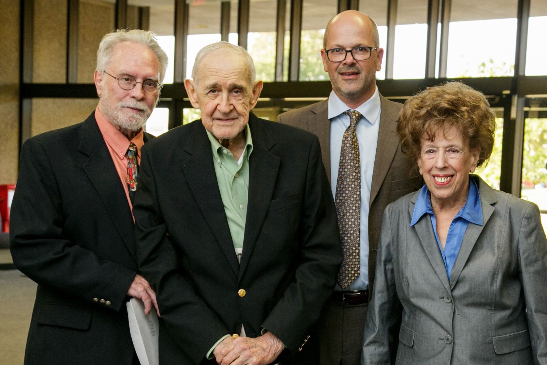 From left, Dr. David Patterson, Edward M. Ackerman, Dr. Nils Roemer and Dr. Zsuzsanna Ozsváth at the Burton C. Einspruch Holocaust Lecture in 2016.